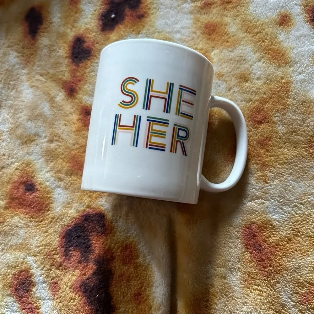 Room Essentials “She Her” coffee mug- white mug with rainbow text